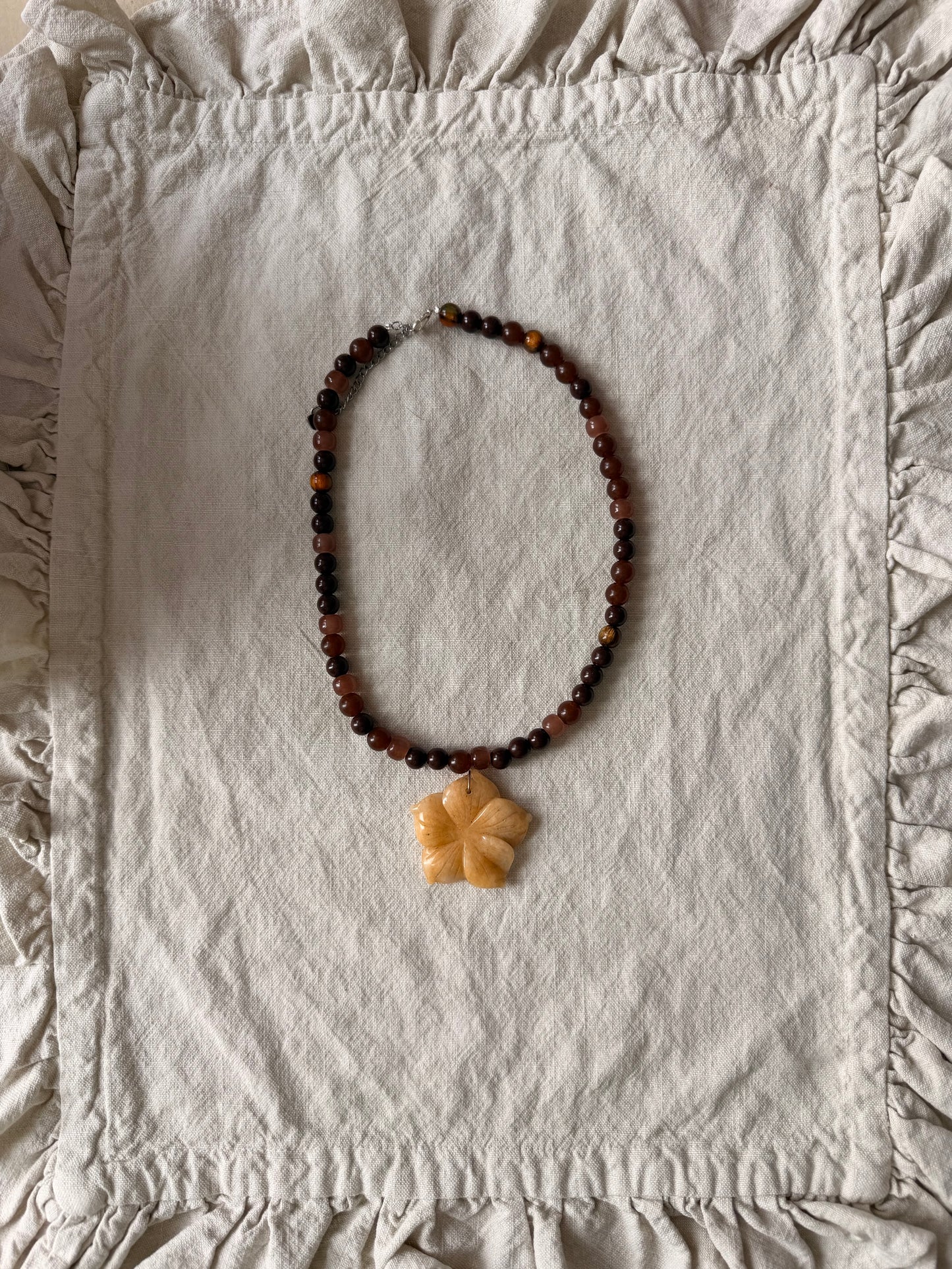 Beachy flower on brown beads