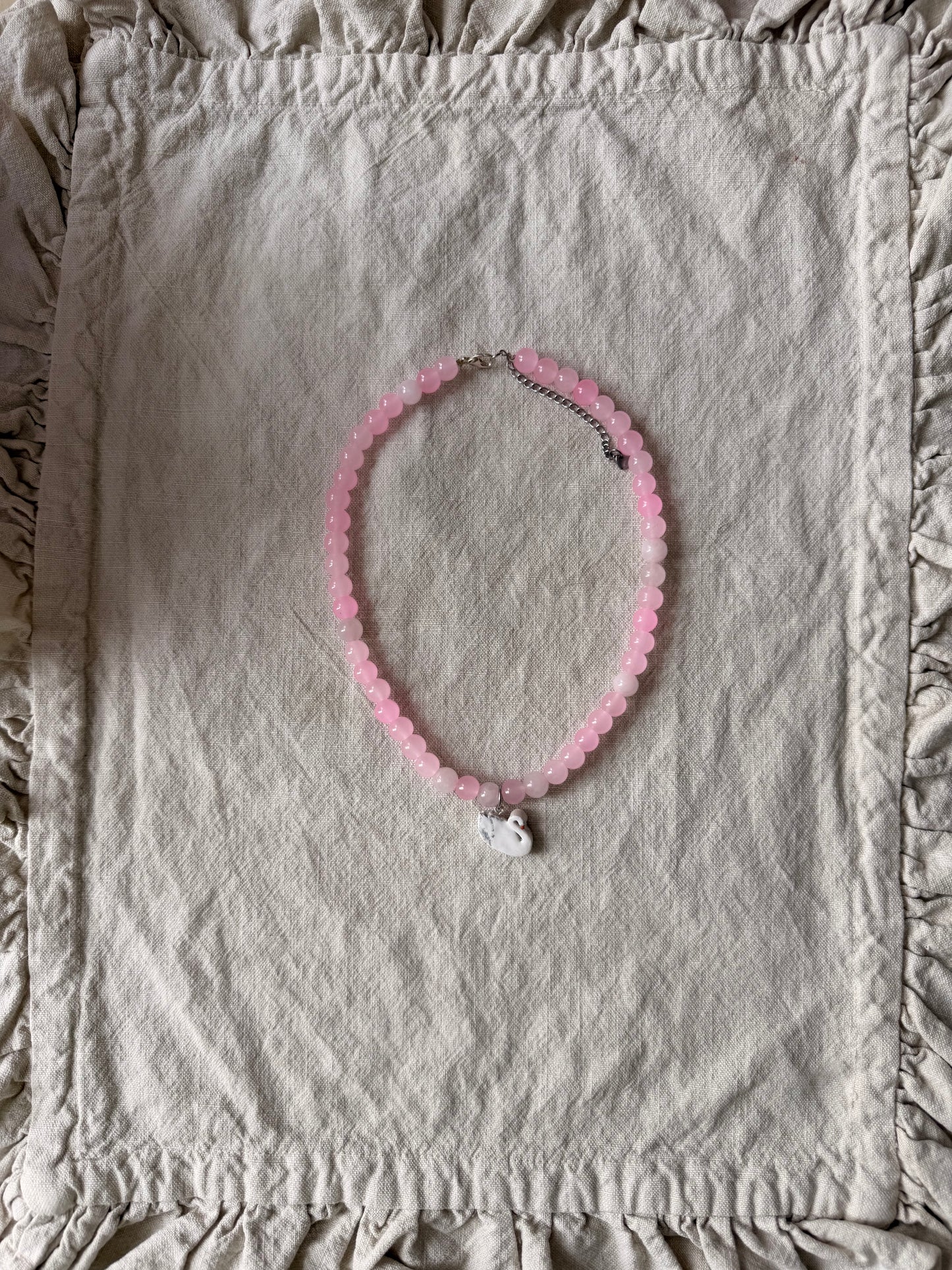 Swan on pink beads
