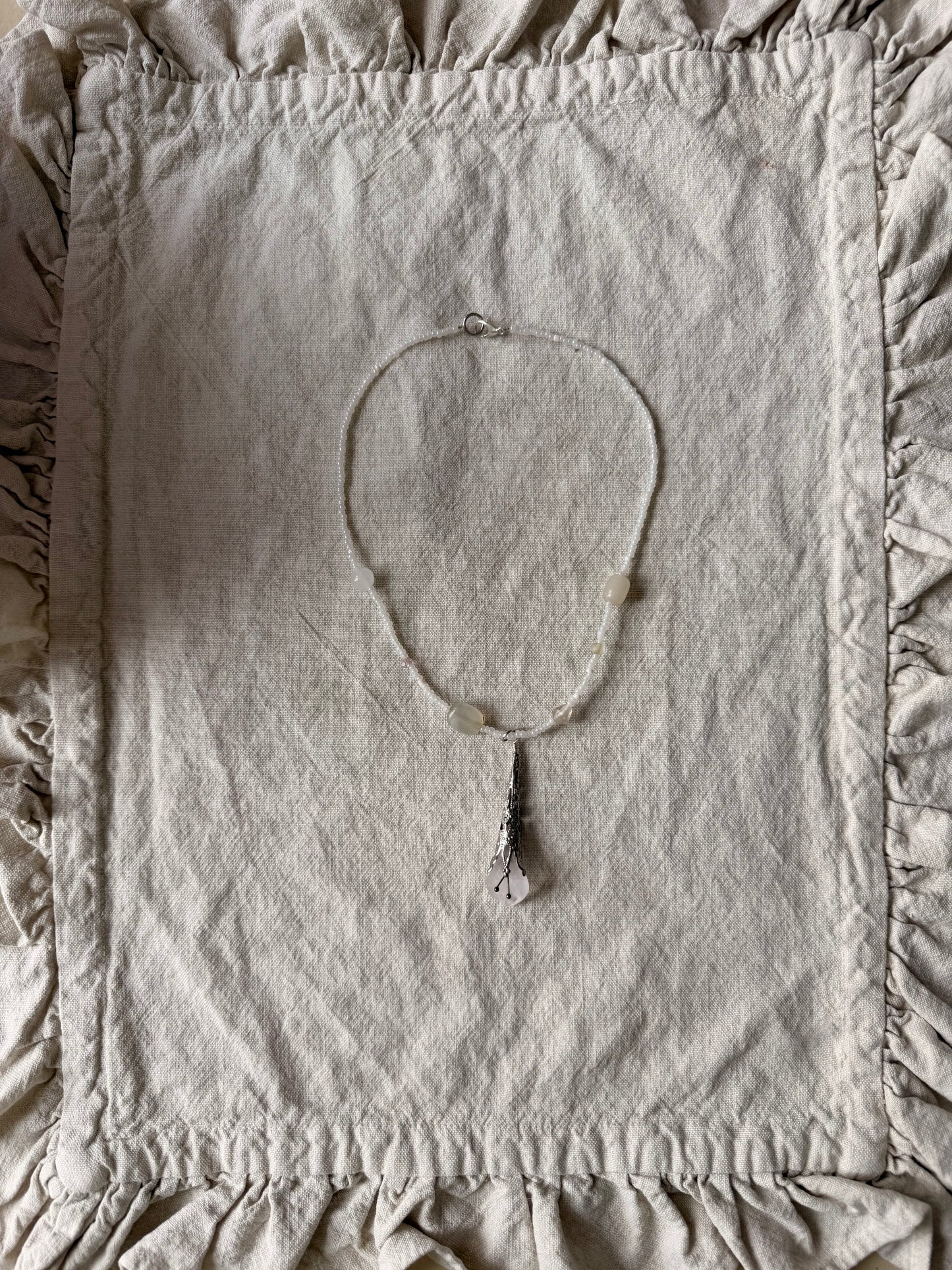 Vintage flower on soft white beads