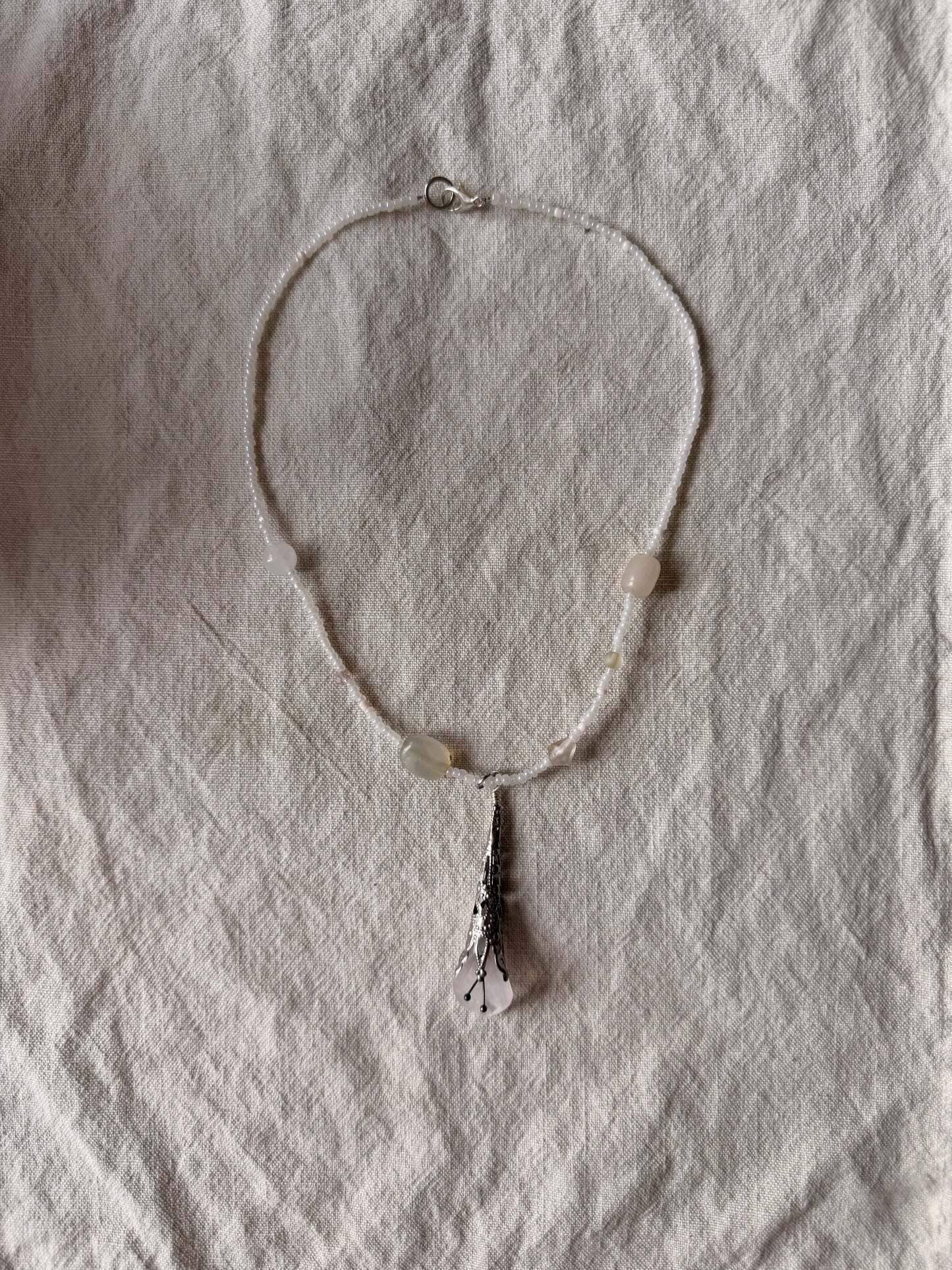 Vintage flower on soft white beads