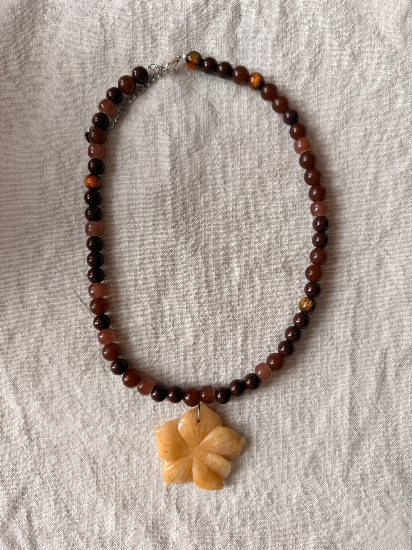 Beachy flower on brown beads