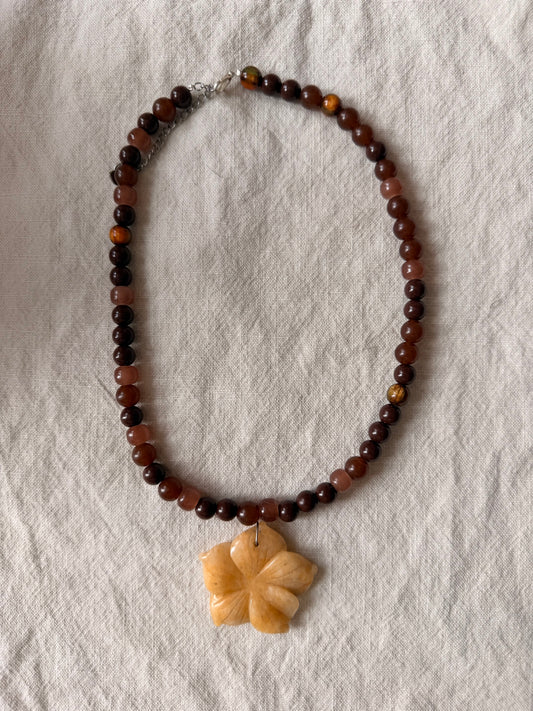 Beachy flower on brown beads