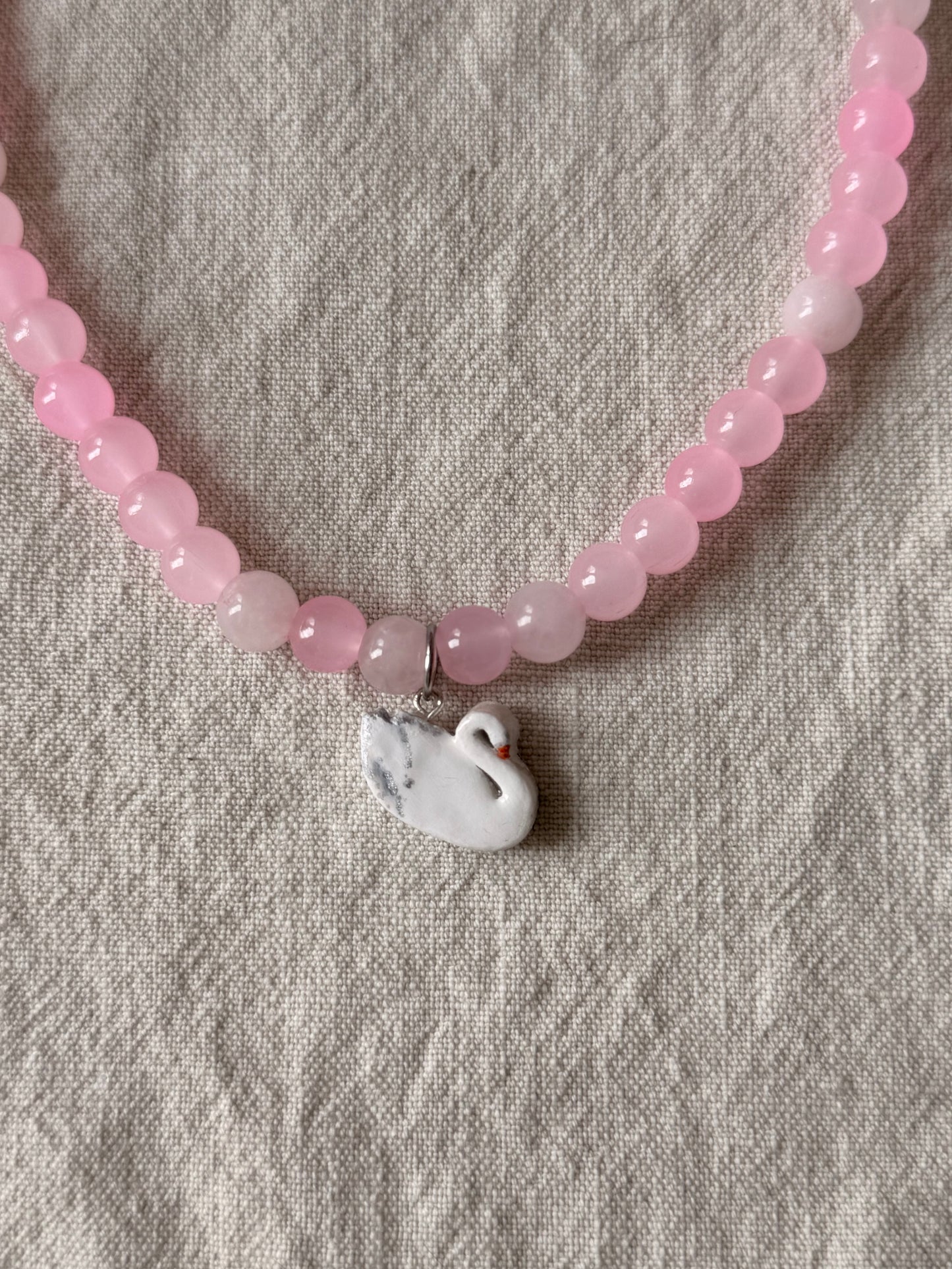Swan on pink beads